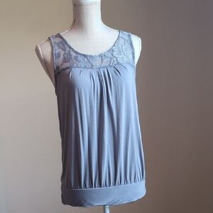 Express gray sleeveless top with floral lace yoke, pleated and banded hem